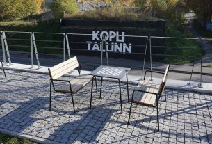 Outdoor seating area with "kopli tallinn" sign